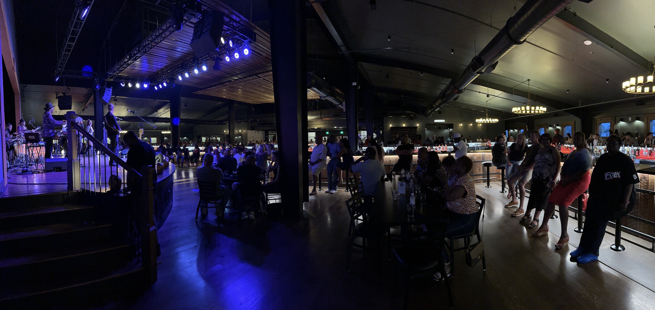 A live performance surrounded by the Humble Baron bar